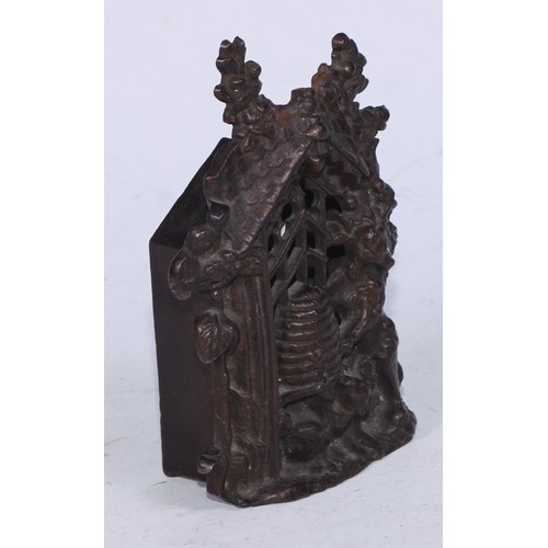 5215 - A Victorian cast iron money box, cast as a bear at a beehive, within a Gothic niche, 14cm high, Rd. ... 