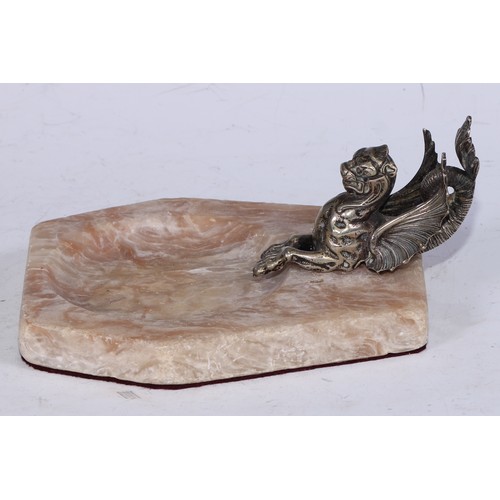 5240 - An alabaster desk tidy, mounted with a silvered wyvern, 15.5cm wide