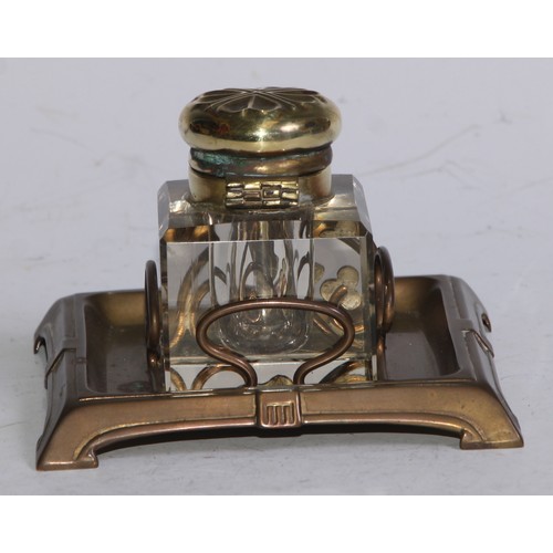 5246 - An Art Nouveau brass and enamel square inkstand, decorated with an ivy leaf, the glass well with hin... 