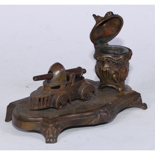 5254 - An early 20th century cold painted spelter novelty inkstand, the Rococo Revival well set beside a mo... 