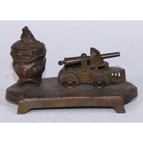 5254 - An early 20th century cold painted spelter novelty inkstand, the Rococo Revival well set beside a mo... 