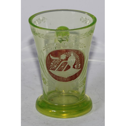 5063 - A Bohemian uranium spa glass, loop handle, 11cm high