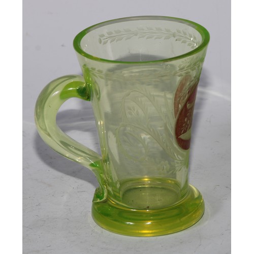 5063 - A Bohemian uranium spa glass, loop handle, 11cm high