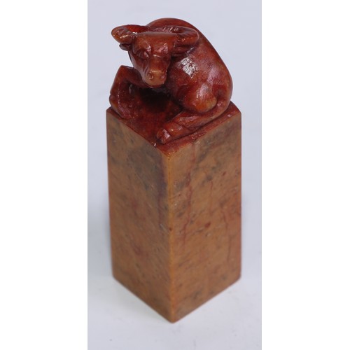 5203 - A set of twelve Chinese soapstone seals, each carved with a stylised beast, 6.5cm high; another, car... 