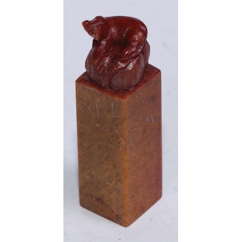 5203 - A set of twelve Chinese soapstone seals, each carved with a stylised beast, 6.5cm high; another, car... 