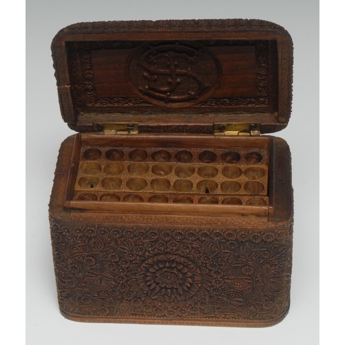 5272 - An Indian hardwood folding cigarette box, profusely carved in relief with stylised lotus, folding in... 