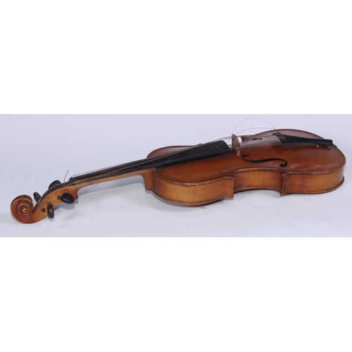 5223 - A violin, the two-piece back 35.75cm long excluding button, ebonised tuning pegs, outlined throughou... 