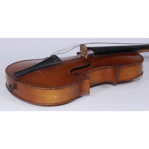 5223 - A violin, the two-piece back 35.75cm long excluding button, ebonised tuning pegs, outlined throughou... 