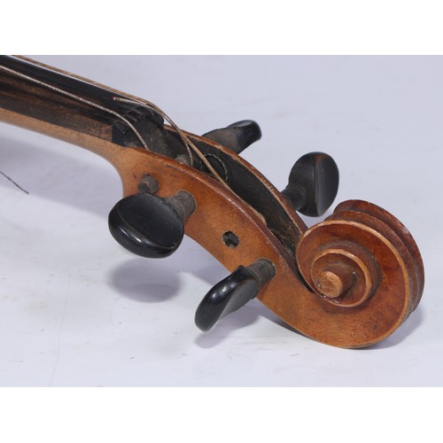 5223 - A violin, the two-piece back 35.75cm long excluding button, ebonised tuning pegs, outlined throughou... 