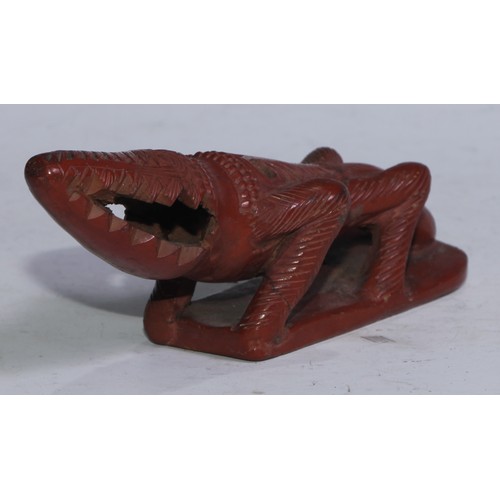 5267 - An Egyptian Assyut terracotta bath rasp, as a crocodile, 20cm long