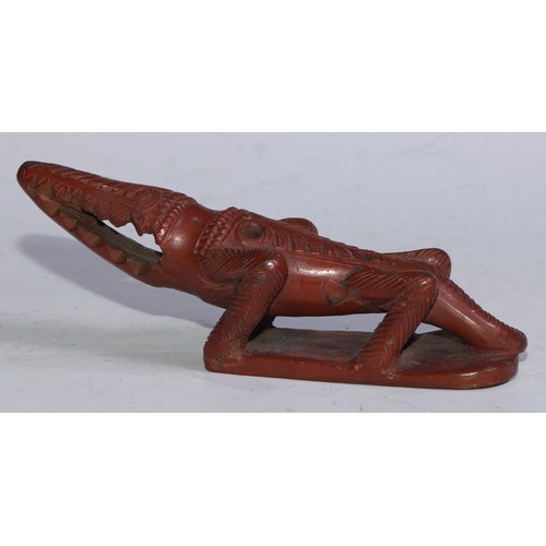 5267 - An Egyptian Assyut terracotta bath rasp, as a crocodile, 20cm long