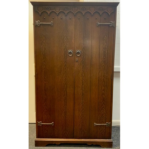 74 - An oak bachelor's wardrobe, 167.5cm tall x 96cm wide x 48.5cm deep.