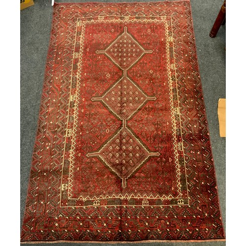 114 - A fine Persian Shiraz woollen rug / carpet, woven with a triple row of medallions within a large cen... 