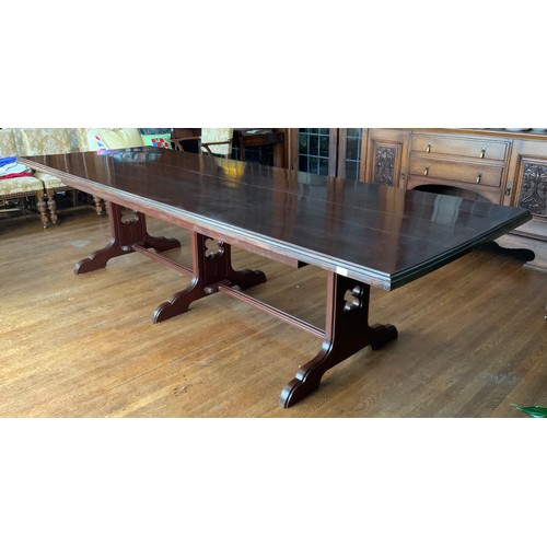 76 - A large rectangular mahogany stained dining table, moulded edge, central stretcher with three fluted... 