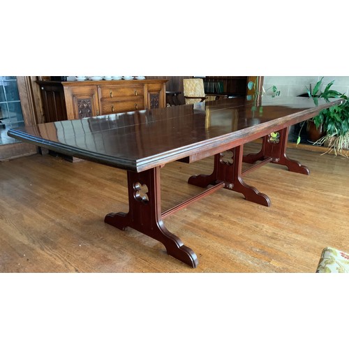 76 - A large rectangular mahogany stained dining table, moulded edge, central stretcher with three fluted... 