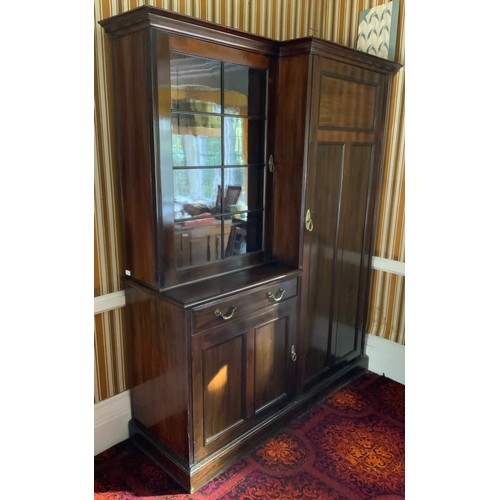 23 - An early 20th century mahogany hall cupboard, the breakcentre cornice, astragal glazed door, above d... 