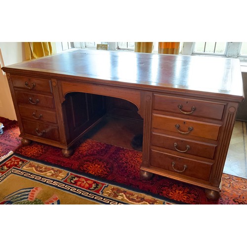 27 - A late 19th/early 20th century mahogany partners desk, tooled leather writing surface, central drawe... 