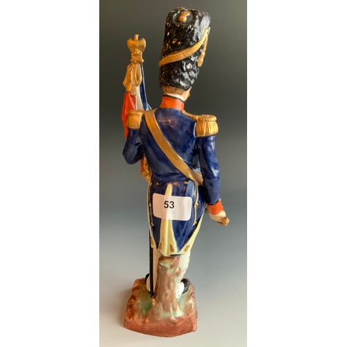 53 - A Naples Capo-di-Monte Military figure, of a Napoleonic standard bearer, Garde-Drapeau des Grenadier... 