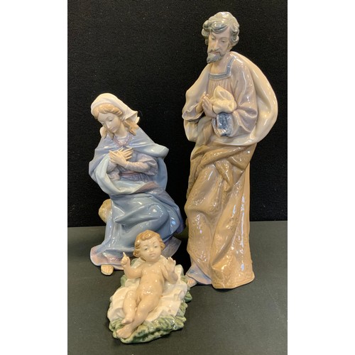 66 - A Lladro figure Virgin Mary, model no 1387;  others Joseph and Baby Jesus, printed marks, two boxes ... 