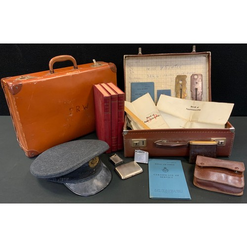 76 - RAF peak cap;  brass button polishers;  lighters;  two suitcases;  Air Force Airman's service book; ... 