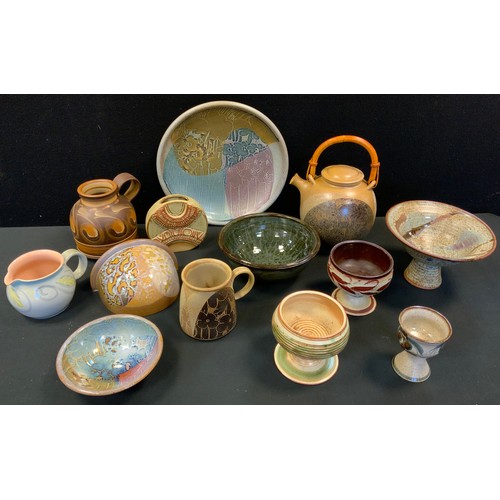 79 - Studio pottery  - Alan Ward pedestal bowl, Crich pottery tea pot, charger wall pocket;  Celtic potte... 