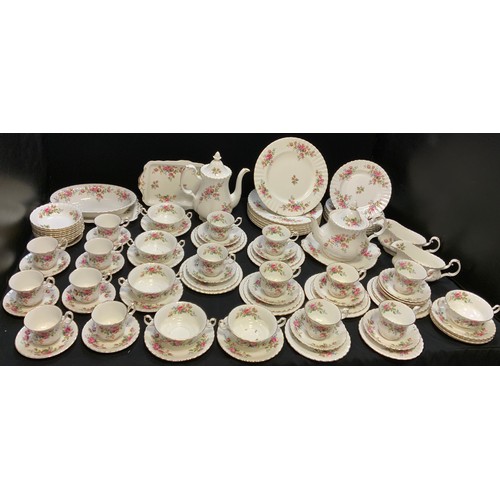 83 - A Royal Albert Moss Rose dinner and tea service, comprising 12 dinner plates, 8 dessert plates, 6 ch... 