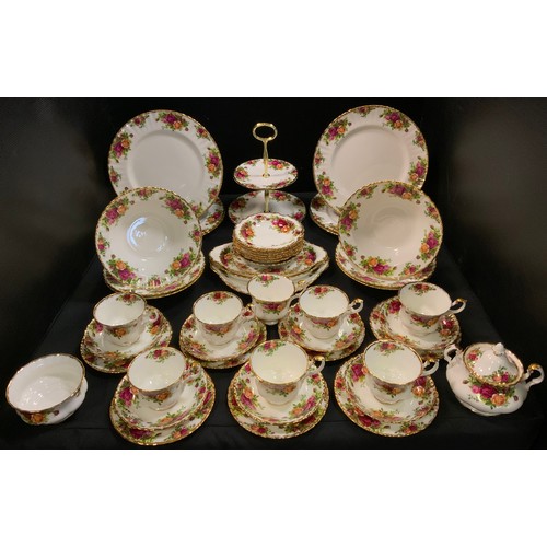 101 - A Royal Albert Old Country Roses tea service, for eight, including two tier cake plate;  serving dis... 