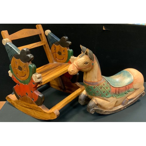 149 - A child's hardwood novelty 'clown' rocking chair;  a hardwood rocking horse (2)