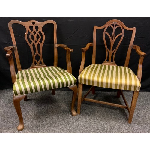 158 - A 19th century Hepplewhite elbow chair;  a Chippendale elbow chair (2)