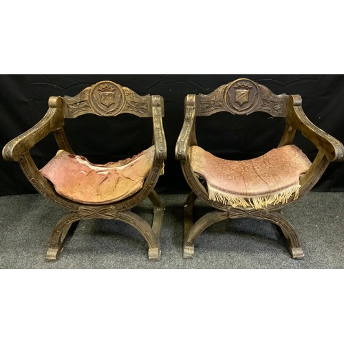 161 - A pair of oak X-frame 'Bishop' chairs, the backs carved with a shield, c.1870