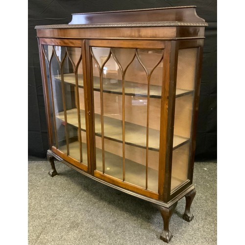 162 - An early 20th century bow fronted double door display cabinet, ball and claw feet,138cm high, 120cm ... 