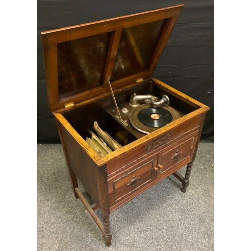 52A - An early 20th century gramophone, in oak cabinet, turned legs, 69cm wide, c.1930