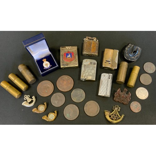 230 - A plated vesta case, with enamelled badge for Sutton;  various lighters;  cap badges;  bakelite hors... 