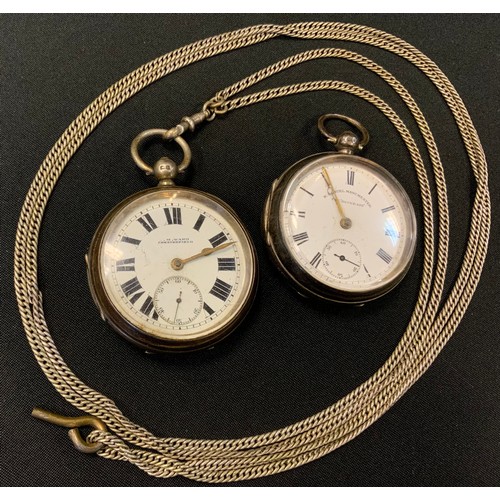 249 - A George V silver openface pocketwatch, Birmingham 1911, suspended from a silver coloured metal muff... 