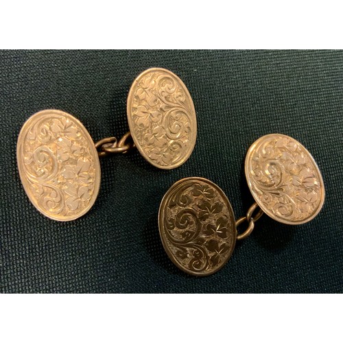 258 - A pair of 9ct gold oval floral panel cufflinks, Chester 1909, 6.2g gross