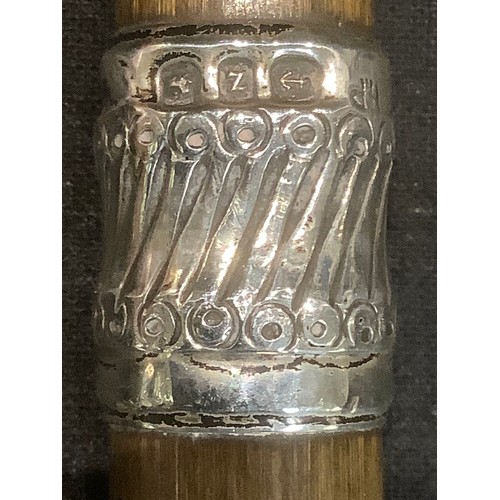 482 - Walking Sticks - a Victorian silver mounted walking cane, Birmingham 1899; others similar (3)