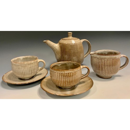 40 - David Leach (1911 - 2005), A fluted stoneware tea service for five, comprised of teapot, milk jug, s... 