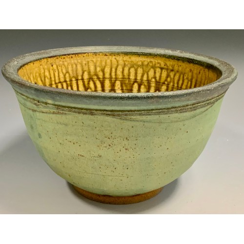 76 - Walter Keeler (Bn 1942), a studio pottery jardinere, the exerior mottled and ridges, the interior wi... 