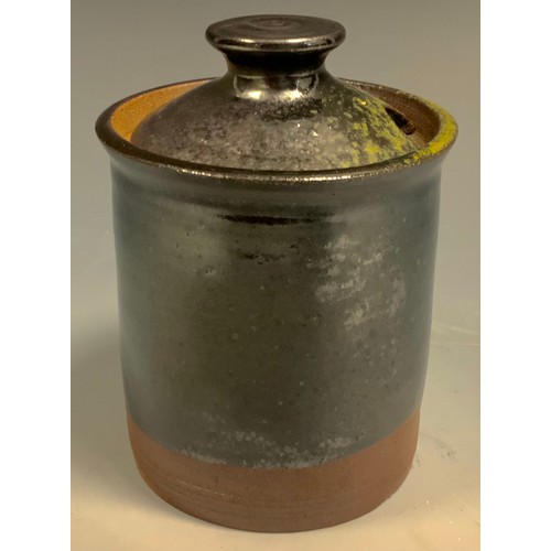 92 - A Dame Lucie Rie style studio pottery preserve jar and cover, glazed in two tone metallic ark chocol... 