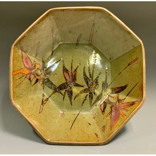 95 - In the style of Dan Arbied (1928-2010)  an octagonal studio pottery table bowl, painted with stylize... 
