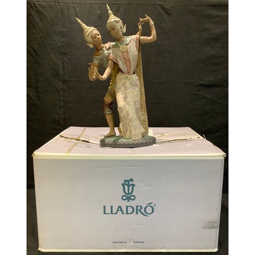 21 - A large Lladro porcelain figure group, Thai Couple, model no. 12058, 53cm high, boxed