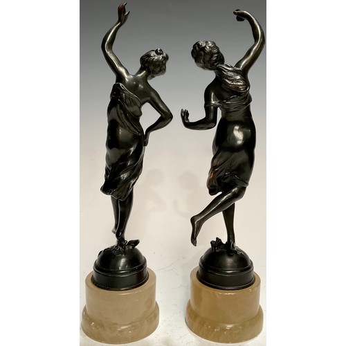 41 - A pair of early 20th century bronzed metal figures, Allegorical of Spring, alabaster type bases, 34.... 