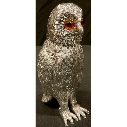 74 - A large silver plated novelty caster, as an owl, 15cm high