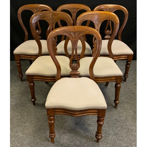 310 - A matched set of six Victorian mahogany balloon-back dining chairs, carved lyre-shaped splat, serpen... 