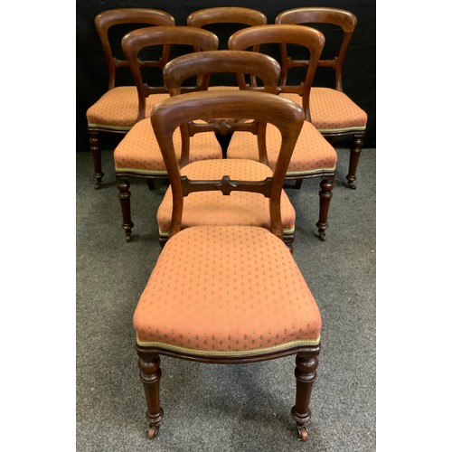 311 - A set of seven mid-Victorian mahogany balloon-back dining chairs, upholstered seats, turned legs, ce... 