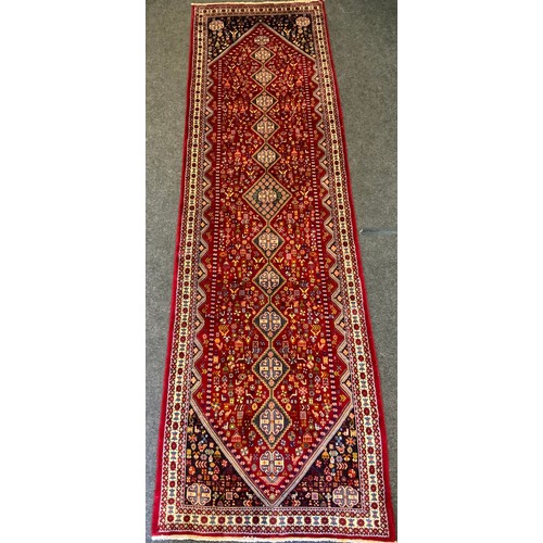 316 - A fine Persian Abadeh runner rug / carpet, the central field densely woven in tones of deep red, ind... 