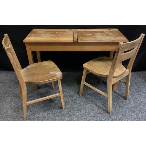 331 - A vintage double seat school desk, twin lifting section top, block legs, with two chairs