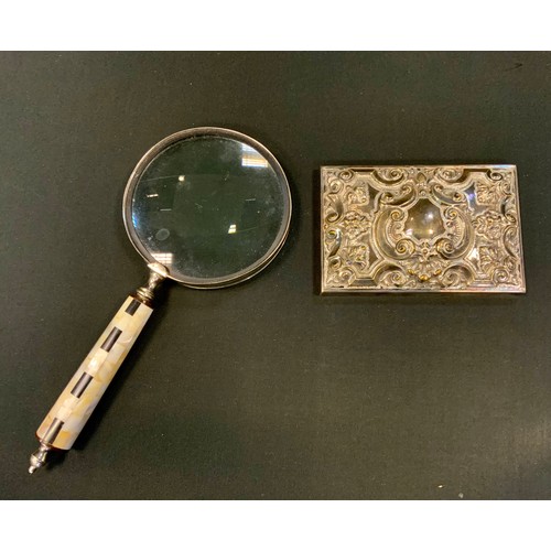 377 - A large magnifying glass, mother of pearl and black onyx handle;  a silver plated panel.