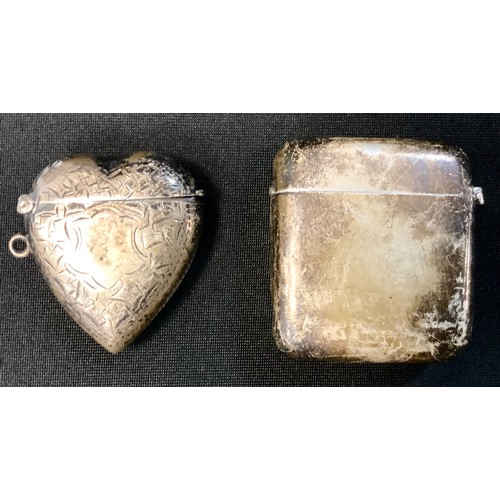 380 - An Edwardian silver heart vesta case, Birmingham 1903;  another rounded rectangular, 61.9g (2)