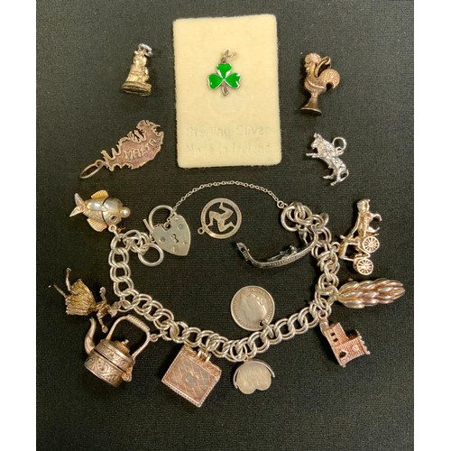 408 - A silver charm bracelet, nine suspended charms and others loose inc teapot, gondola, bananas, etc, p... 